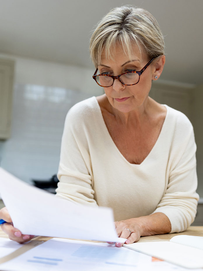 A woman holding a paper